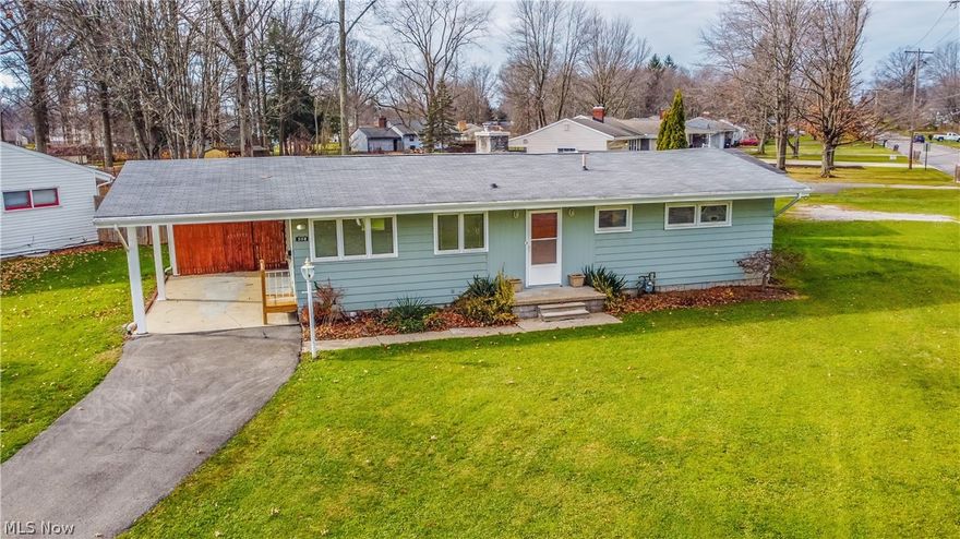 Situated on an oversized corner lot, this Austintown ranch home is looking for a new owner......could that be you? Offering a great layout with spacious living room featuring a floor to ceiling brick fireplace and large picture window. Well-equip galley style kitchen with bright white cabinets, plenty of counter space and stainless steel appliances.  Three nicely sized bedrooms. Full basement and detached 2 car garage and attached carport. Call today for your private tour.