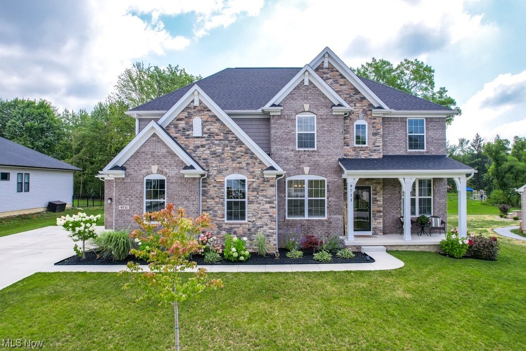 Want the feel of new construction without the wait & added costs once you move in? THIS 1 yr young dream home is waiting for you! Home has all of the perks of new construction including limited & lifetime warranties on most of the home, the modern look every buyer dreams of today, that new smell, all of the building upgrade options you could want, & the owners have already put in over 40k of MORE updates since they moved in. You don't have to worry about adding landscaping, a HUGE composite deck that was approx 25k-recently installed, appliances upgraded, new lighting throughout- their list of updates goes on & on- ask your agent for the full list. This home has 2 story living rm ceilings you've wanted w/views of the .75 acre lot that you're on- partially wooded for privacy. 1st flr gives you the open layout to the upgraded kitchen w/quartz counters, upgraded cabinets w/hardware, even your oven is newer w/a built in air fryer! Off of the kitchen is a built in coffee bar w/the same kitchen aesthetic. Home has 3 car garage & OVER 3,000 sq ft space above ground- 4 bed/2.5 bath, & an unfinished basement. Basement was built w/waterproof barrier, has added egress window to make a 5th bedroom, & plumbed for full bathroom. Tankless h2o heater, powerful HVAC, roof, electric panel, plumbing, siding, windows, EVERYTHING- built in 2022 so no need to budget for replacement any time soon. You can't beat this location- close to freeways, 2 golf courses, Brecksville Reservation & more.