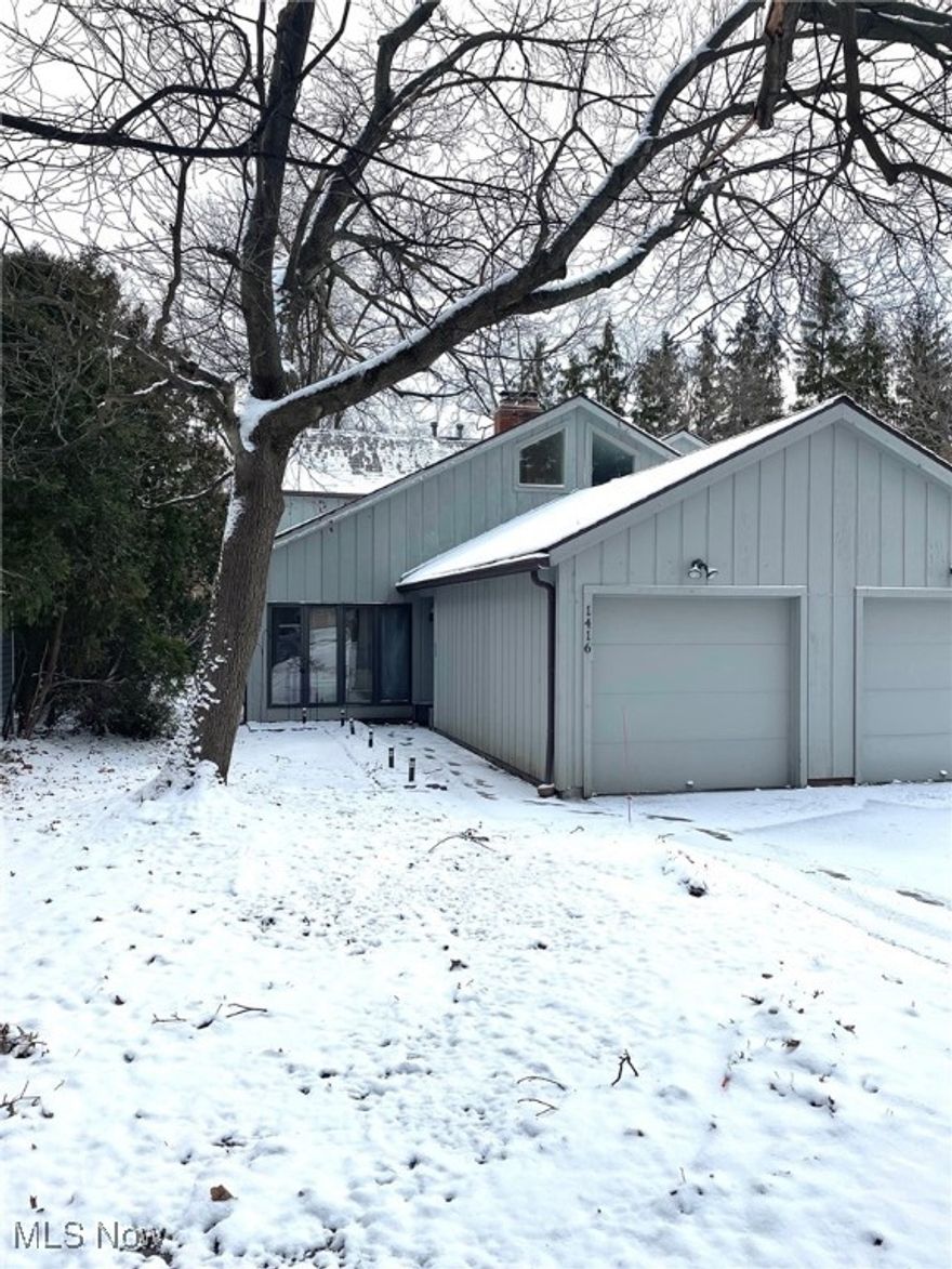 Exciting opportunity to own a move-in ready end-unit condo in the heart of Cleveland Heights! This inviting home offers 2 bedrooms, 2 full bathrooms, and 1,444 sq. ft. of living space. A large foyer welcomes you through French doors into a spacious open living and dining area.  Both feature vaulted ceilings and are complemented by hardwood floors and a brick fireplace (gas). The kitchen boasts ceramic tile flooring, ample cabinetry and counter space, and stainless-steel appliances, all of which were replaced within the last three years. Continuing down the hall leads to the second bedroom, updated bathroom, utility closet with a full-size washer and dryer, and access to the backyard patio. Upstairs, the primary suite features a huge walk-in closet, a fully updated bathroom with a floor to ceiling walk-in shower, and a private balcony overlooking the peaceful backyard. The hot water tank and garage door mechanism have also been recently replaced for added peace of mind. Conveniently located minutes from Severance Town Center, Forest Hill Park, Coventry Village, University Circle, and Downtown Cleveland. Schedule your private showing today!