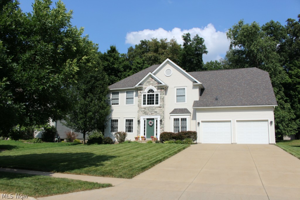Looking for a new home in a lovely neighborhood? Look no further. Come to see this spacious colonial home in Stow Woods. You will definitely love all it has to offer: 5 bedrooms 4 bathrooms, mud room, 2nd floor laundry, fireplace, open kitchen with island and bayed eating area, large sized master bedroom, garden tub in master bathroom, ceramic tiled basement, deck and patio in the backyard for entertaining, spacious partially fenced yard for kids to play... with stone accent in front, nested in a quiet neighborhood, sitting on professionally landscaped site, this absolutely gorgeous home is in a great location, it 's close to schools, shops, restaurants, parks and highways. It's only a few minutes away from Kent State University, about 20 minutes from the University of Akron... Call today for showing and make this nice home yours!
