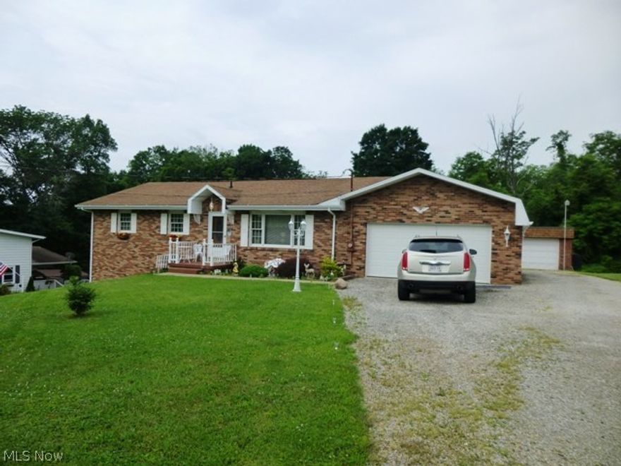 Immaculate home ready to move into. appliances will stay in kitchen. Everything has been updated. When the owners added on the home with the 2 car atached garage they also added the laundry room. There is a half bath off laundry. Covered porch on back of home. 1 car garage under home was boarded up but could be re-opened if needed. Also a large 2 car detached garage behind home with own electric, water and oil furnace. Also has a new roof. Garage doors on both garages. Shower in basement.