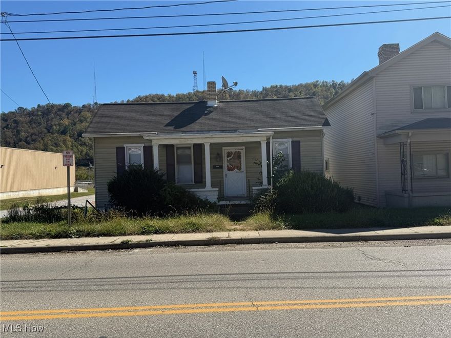 One story home located on National road in Bridgeport. Home has 2 bedrooms with one being captured upstairs with a full bath and living room. Downstairs consist of kitchen, bonus room, and laundry/ utility room. Home has a fenced in backyard.