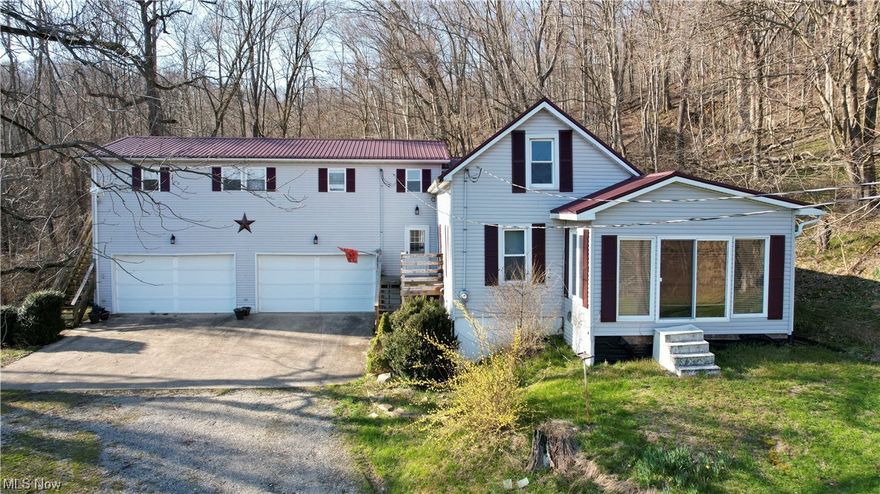 Mineral rights will transfer on this property and there is no current lease and property hasn't been timbered for approx. 30 years.  There are 4 bedrooms and 2 full baths; a four season sun porch on the front of the house to watch the sunrise or the sunset.  The main floor also has a living room with new flooring, dining room with new flooring, master bedroom, full bath, large kitchen with new flooring and lots of cabinets and a bar; stove-refrigerator and dishwasher included, main floor laundry room.  The second level has 2 bedrooms.  The two stall attached framed garage (30 x 40) has full living quarters upstairs was built in 2005, this can be used as an income apartment property or the 4th bedroom and 2nd full bath, incudes a full kitchen, living room and separate entrance; 200 amp. service.  Steel roof 2022; HWT 2021; Windows 10 years; Vinyl siding 2005; Culligan water conditioner unit June 2021. Separate electric bills for house/living quarters/well house.