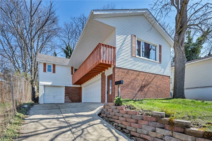 Welcome to this amazing 3-bedroom, 2-bathroom home located in the desirable Akron area! This beautifully updated property offers modern comforts and a spacious layout, perfect for family living. Step inside to discover brand new vinyl flooring throughout the main areas, paired with fresh new carpet throughout. The open kitchen is ideal for entertaining, featuring ample counter space and easy access to the main living areas and your personal balcony, perfect for morning coffee or evening relaxation. Three generously sized bedrooms provide plenty of room for rest, while the two large full bathrooms offer modern fixtures and plenty of space for your daily routines. A rare big highlight is the home’s 3-car garage, offering plenty of space for vehicles and additional storage The backyard is a private oasis, the fully fenced in yard provides a peaceful retreat for outdoor gatherings or quiet moments. A new retaining wall installed last year adds both functionality and aesthetic appeal. With a spacious basement that includes a dedicated workspace, you’ll have plenty of room for hobbies or storage. Recent updates include a new furnace, A/C, and new electrical panel ensuring comfort, efficiency, and peace of mind year-round.This home combines modern updates with plenty of space and privacy – schedule your showing today!