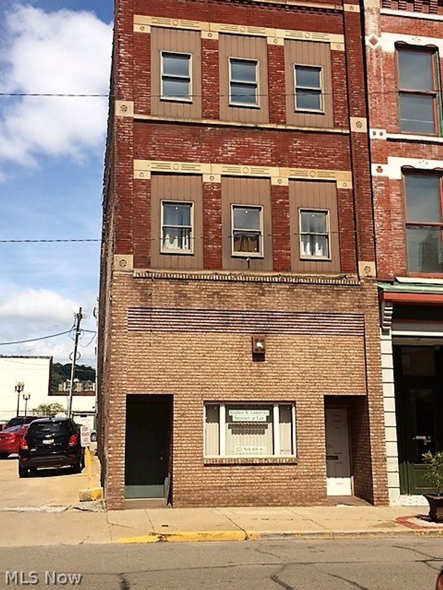 Opportunity!! Fourth Street is making a comeback and you can be part of it. This property is priced to sell. There is an office on Main floor and apartment upstairs with parking lot in back. Walking distance to courthouse and centrally located. Call now to see!!