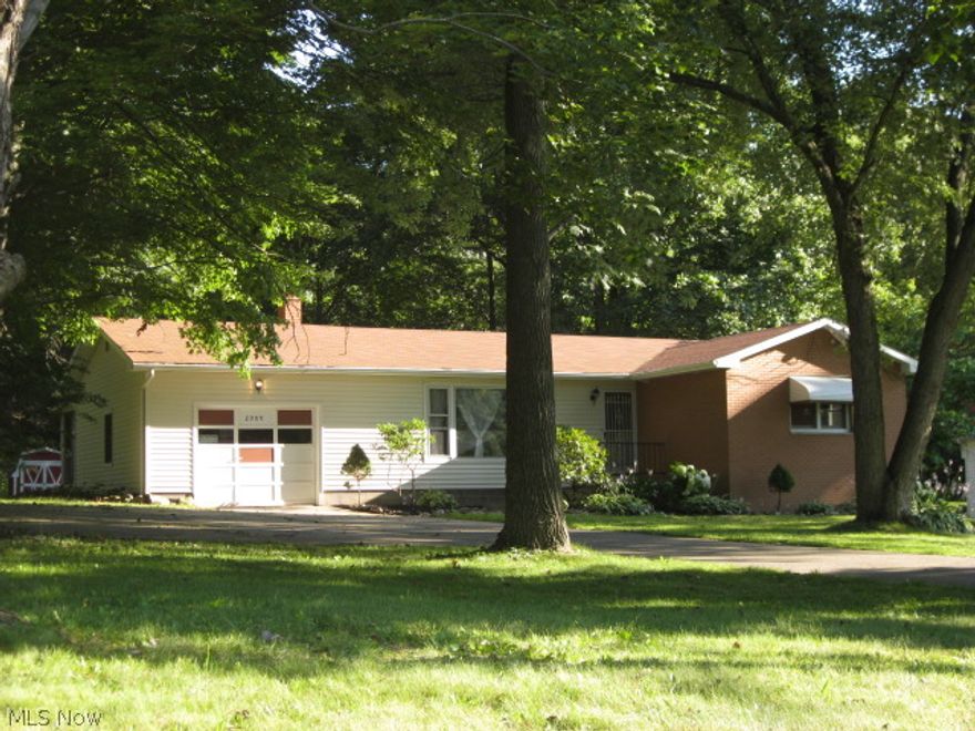 Over 1 full acre in GREEN. Priced to sell !!! This one owner occupied home features. Fresh paint and flooring throughout. Three nice size bedrooms with hardwood floors. Pella wood replacement windows & doors throughout home. Updated bathroom with granite counter top. Nice kitchen with new flooring, lighting, counter tops, sinks, faucets, kitchen island/bar. Bonus sun room attached to dining area. Nice screened in patio room with sky lights. Clean dry basement with finished recreational room & lots of storage. New central A/C unit & water heater, updated 90% efficient Carrier furnace. Property has been recently landscaped. Storage barn for your yard tools. Great location in the heart of GREEN, don't' miss out on the opportunity to own this property.