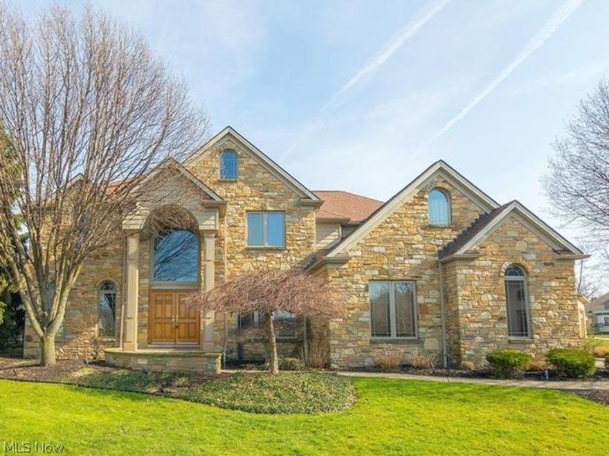 RECENTLY REDUCED! This absolutely beautiful home, constructed by one of Cleveland's leading event designers located in the heart of desired the Aberdeen community, features an exceptional stone exterior with 2 story granite floored foyer and a palladium window. Living room w/crown molding, spacious dining room w/butler station for entertaining. 2 story great room that flows into a gourmet kitchen w/custom cherry cabinets, granite counter tops and  new upgraded stainless steel appliances 2016. First floor den w/full bath, provides 5th bedroom option. Private backyard retreat has a beautiful patio, outdoor kitchen, gas burning fireplace and enough space for the children to play, showcased by exquisite landscaping. Perfect for entertaining! 2nd floor master suite w/lounge area/reading room and spa-like master bath w/custom marble and cherry cabinets. Large master closet with built in dresser and new flooring. Conveniently located 2nd floor laundry, zoned HVAC each floor. Finished basement