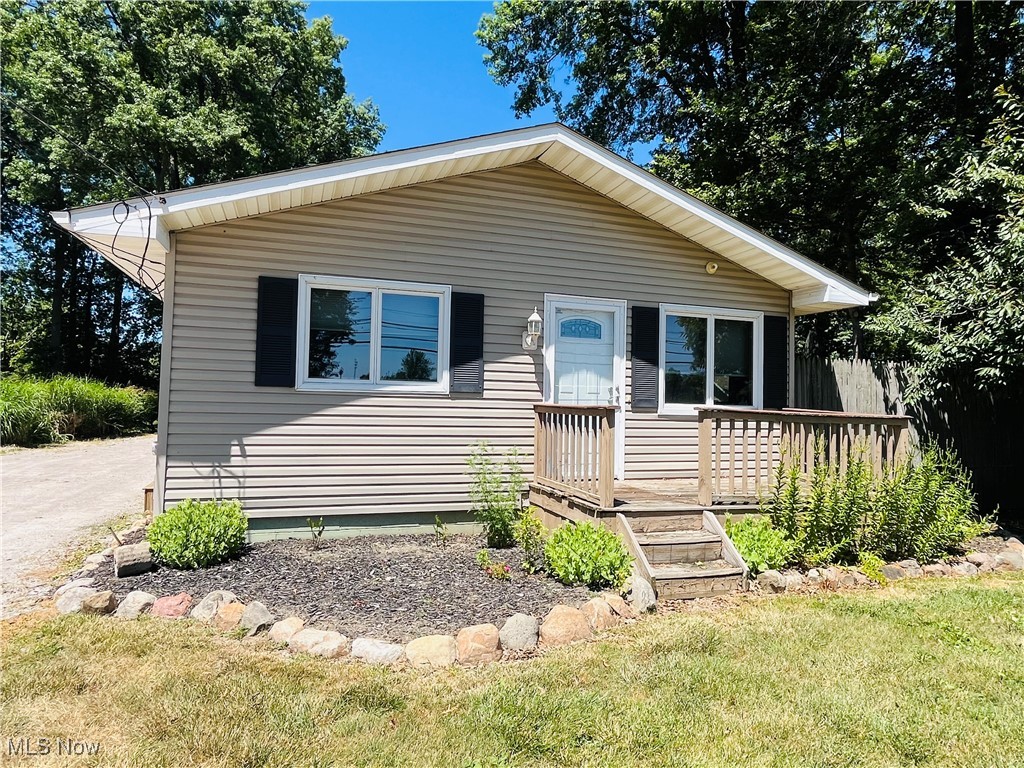 Charming and completely updated 1960s ranch bungalow on over half an acre! IN the city. This is unique - the property is comprised of eight lots, and offers an enormous backyard, tall and robustly healthy trees, beautiful landscaping, three garage spaces, workshop amenities, heated garage, and so much more! We haven't even mentioned the updated kitchen with new appliances, the fully renovated bath with custom tiled shower, new windows and exterior doors, custom blinds, finished basement with drop ceiling (2022), newer mechanicals (furnace in 2015, hot water tank in 2020), water softener, upgraded electrical and lighting... There's so much to see and appreciate - more than meets the eye. Quality and care throughout. And the entertaining possibilities on the back deck and in the backyard are endless. Privacy fence, fire pit, and an extraordinary amount of lawn space. Across the street from a beautiful city park, and close to area attractions - Lake Erie, restaurants, theater and arts center, walking trails, and Ashtabula Harbor for some of the finest foodie experiences in the area.