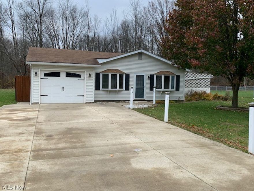 Charming Ranch Home w/3Beds, 1 Bath, and attached Garage located in nice family neighborhood in Perry Twp. that is minutes from I-77. This home offers a nice country setting w/updated Kitchen, Bath along with enclosed back patio overlooking private backyard with garden and firepit. Home also has 8x8 storage shed and large 20x15 workshop with electric. This home is move-in ready and wont last long!  Schedule your showing today!