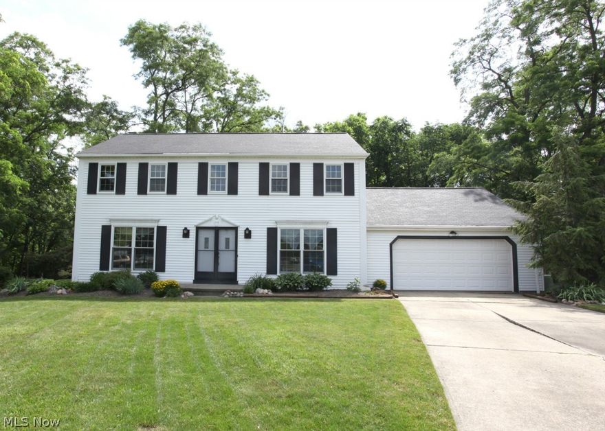 Welcome home to this lovely 2-story foyer! Family room offers the warmth of a gas or wood burning fireplace. The kitchen has ceramic tile & is an open concept w/an eat-in area. A large dining room for all your entertaining needs. There is a 1st floor bedroom that can be used as an office, play room, whatever you need. Upstairs has 3 big bedrooms w/ plenty of closet space. The full bath on the 2nd level was recently remodeled w/ a jetted tub. The master bedroom has a vanity area, walk-in closet & master bath. The full basement has a wet bar, vent-less gas fireplace, 1/2 bath, laundry room & storage area. Newer carpet & windows throughout. Garage is 2 1/2 car w/ attic storage, new door & opener. The large deck has a SunSetter awning & a wonderful, private wooded view, a storage shed, electric & a gas line to a fire pit area. Newer roof & gutter guards. So much more to mention, this is a must see! Close to shopping, highway, turnpike and metro parks. Schedule your private showing today!