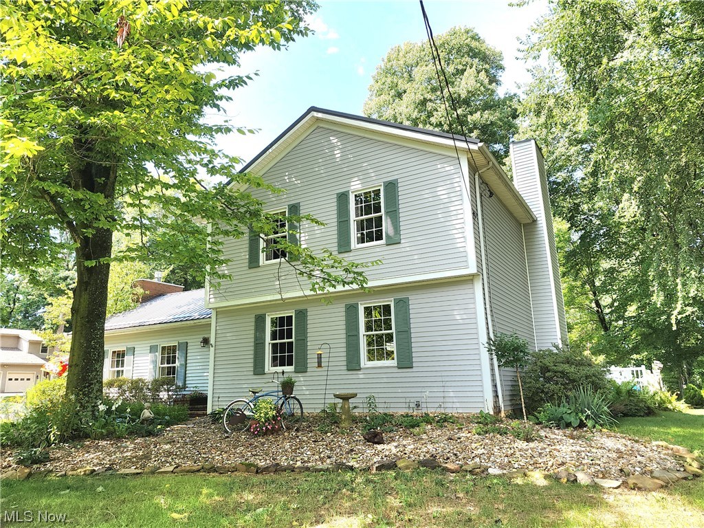 One of the Most Sought After Neigborhoods In The Tri-Valley District (The"Tiffany Circle"). This Updated English Country House Complete with The Landscaping One Would Expect, All Packaged up with 3 Ample Bedrooms, Master includes walkin Closet, 2.5 Baths, Warm And Spacious Main Floor Great Room Complete with Fire Place, Main Floor Laundry, 3 Car Heated Garage with Pull down Stairs for Storage Above,Concrete Driveway , Formal Living Room, Formal Dining Room With 2nd Fireplace, Kitchen with Granite Counter Tops and Center Island with Eating Bar. Master and Hall Baths Have been Completely updated, The Rear Yard has both Brick & Paver Patios Featuring a Buil In Natural Gas Grill Yard Is Partially Enclosed with Vinyl Fencing, Outside the Fence Enclosure the Expanse of Side Yard Features Stone Steps leading to the Landing at the Small Stream Bed Lined with Stone with Cozy Fire Pit to Enjoy the Coming of the Evenings, Exterior Basement Drainage System just enhanced to Asure no Moisture Pen