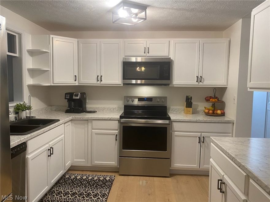 EXTENSIVE UPDATING RECENTLY COMPLETED. 2020 COMPLETE NEW KITCHEN CABINETS, PLANK FLOORING, COUNTERS, SINK DISPOSAL ETC. NEW PLANK FLOOR THROUGHOUT ENTIRE UPSTAIRS.  UPDATED BATHS, NEWER VINYL WINDOWS THROUGHOUT MAIN HOME.  MOVE IN CONDITION HOME WITH HOME WARRANTY INCLUDED.  SHOW & SELL.