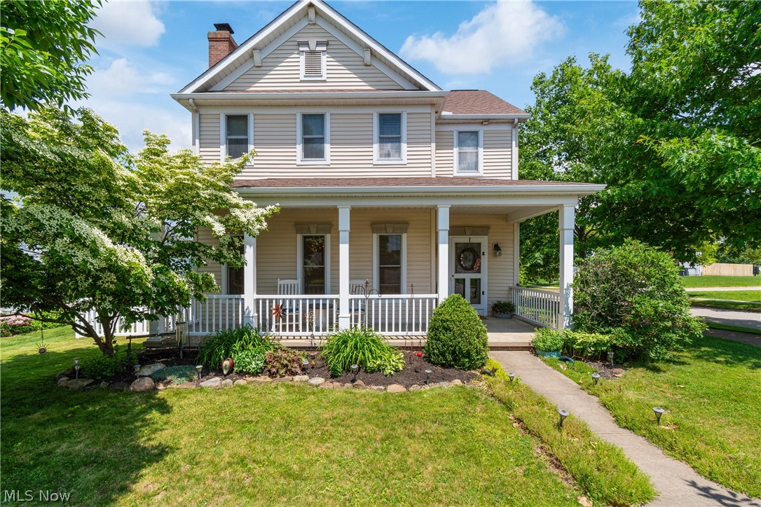 Nothing to do but move into this adorable Dutch Heritage built, 3 bedroom, 2.5 bath home in the New Haven development. A covered front porch greets you as you enter this home located on a corner lot. The welcoming living room features hardwood floors and a wood burning brick fireplace as well as large windows allowing plenty of natural light. The open kitchen offers ample cabinets and leads into the dining room with sliders that invite you to an additional covered porch overlooking the vinyl fenced in backyard. A half bath and 1st floor laundry room round out the first floor. Upstairs, the master bedrooms features a walk-in closet and full bathroom with newer counter. Two additional bedrooms and a full bathroom complete the second floor. The full basement is ready to be finished and is currently being used as a theater area and workout space, while still allowing for extra storage. The attached 2 car garage is located in the back of the house offering built-in shelving and a workbench. Recent updates include new hot water heater (2023), toilet (2024), carpet (2023), thermostat (2023), dishwasher (2021). Don't wait to see this great home!