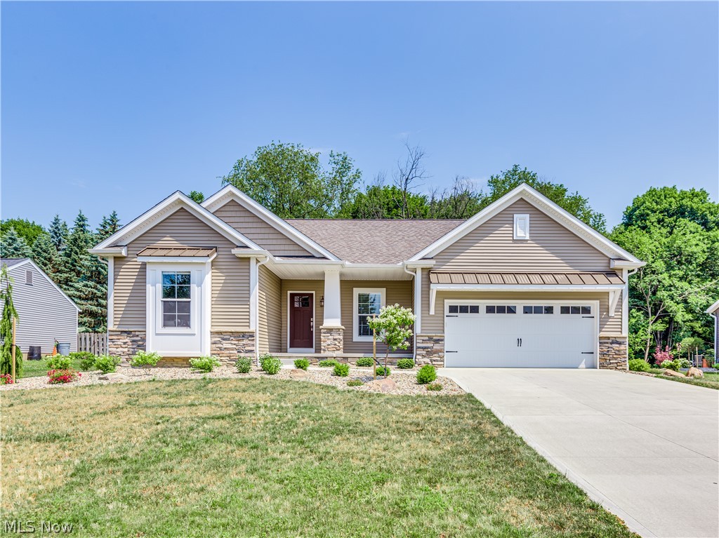Welcome to this beautiful ranch home in Oakshire Place, North Canton CSD. This lovely home sits in 1830 sq ft of living space. Walk up onto the large covered porch and into the foyer with luxury vinyl flooring and 9ft ceilings. An Office/study room is to the right and bedrooms 2 & 3 are to the left (one has a window with a built-in bench with storage), a full bathroom is conveniently located nearby. The open concept kitchen offers appliances, granite countertops, a breakfast bar island, tile backsplash, and plenty of cabinet space. Great sightlines into the great room. The great room has a beautiful stone gas fireplace with raised hearth and easy access to the patio and spacious private backyard. The master bedroom is tucked away for privacy and offers a nice master bathroom with double sink, solid surface countertops, walk-in shower, and a large 5 x 11 walk-in closet. Interlocking vinyl tile flooring is in all bathrooms; beautiful look without the chilly feet. The laundry room/mudroo
