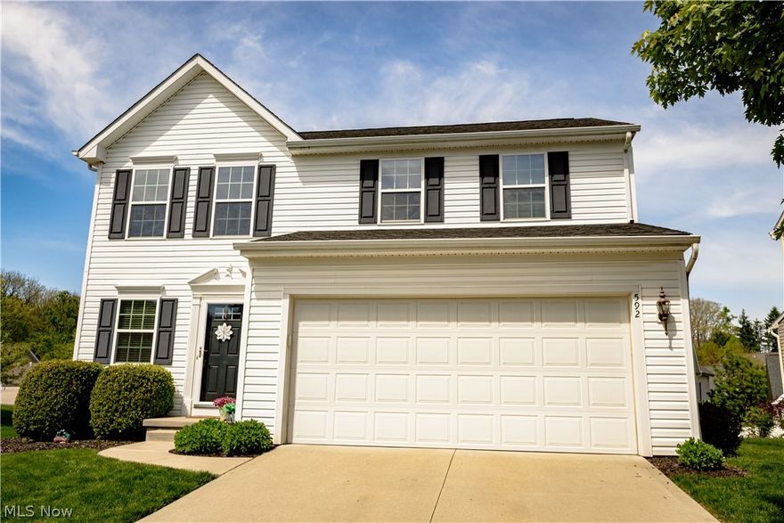 Step inside this immaculate 3 bedroom, 2 full bathroom and 2 half bathroom home in the highly attractive Eastwood Glen neighborhood in the Tallmadge City School District. As you enter the front door and step into the foyer you'll notice the beautiful hardwood flooring throughout the main level which features an open floor plan having a living room with gas logs fireplace, an updated kitchen with granite counter tops, stainless appliances and an eating area, a morning room with a sliding glass door leading to the deck overlooking the backyard that's perfect for entertaining family and friends and an updated 1/2 bath. Upstairs you'll fall in love with the spacious primary owner's suite having a  walk-in closet and private full bath, 2 more ample sized bedrooms, another full bathroom and a convenient 2nd floor laundry room. The lower level is partially finished with a carpeted rec room and another half bathroom which adds almost 400 sq. ft. of useable living space and an unfinished area that's great for storage. Other features include a high efficiency furnace, a newer A/C unit, a 2 car attached garage with opener, meticulously maintained landscaping and more. There is absolutely nothing to do here but move in and enjoy. Conveniently located in a great neighborhood close to parks, restaurants and shopping.