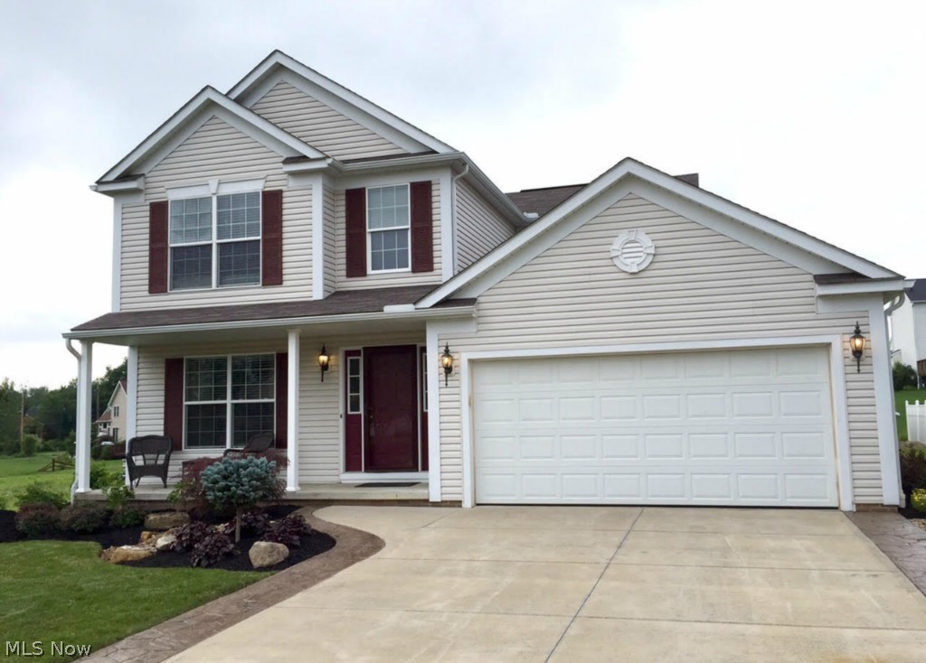 This stunning home, situated in a cul-de-sac inside Brimfield Township & School district. It has been updated from top to bottom and has 2200 sq ft of living space! This house is loaded with extras; stainless steel appliances( with 3 years of warranty remaining), beautiful landscaping, stamped concrete driveway borders for extra room and a completely finished basement with a home theater! Completely updated faucets, fixtures, hinges and door handles for a more modern feel through out the entire home. Updated flooring with carpet in the living room and luxury vinyl- plank laminate throughout the rest of the main level. The living room has a gas fireplace with stone surround. Upstairs, the spacious master bedroom features vaulted ceiling with a private bathroom. Both the master bathroom & 2nd full bathroom feature modern porcelain ceramic tile. The fully finished basement features an AWESOME media room: 7 speaker surround sound, amplifier & home theater projector. A separate area can ac
