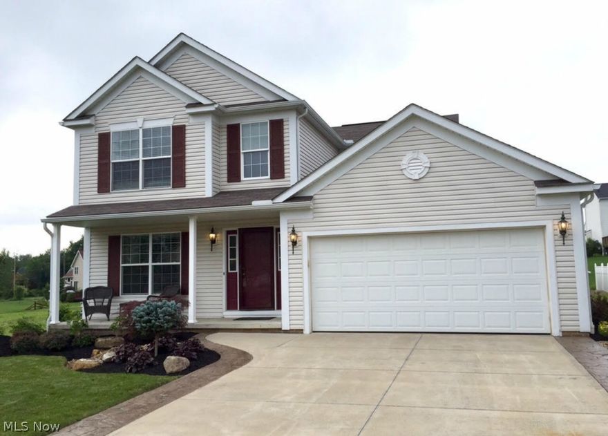 This stunning home, situated in a cul-de-sac inside Brimfield Township & School district. It has been updated from top to bottom and has 2200 sq ft of living space! This house is loaded with extras; stainless steel appliances( with 3 years of warranty remaining), beautiful landscaping, stamped concrete driveway borders for extra room and a completely finished basement with a home theater! Completely updated faucets, fixtures, hinges and door handles for a more modern feel through out the entire home. Updated flooring with carpet in the living room and luxury vinyl- plank laminate throughout the rest of the main level. The living room has a gas fireplace with stone surround. Upstairs, the spacious master bedroom features vaulted ceiling with a private bathroom. Both the master bathroom & 2nd full bathroom feature modern porcelain ceramic tile.  The fully finished basement features an AWESOME media room: 7 speaker surround sound, amplifier & home theater projector. A separate area can ac