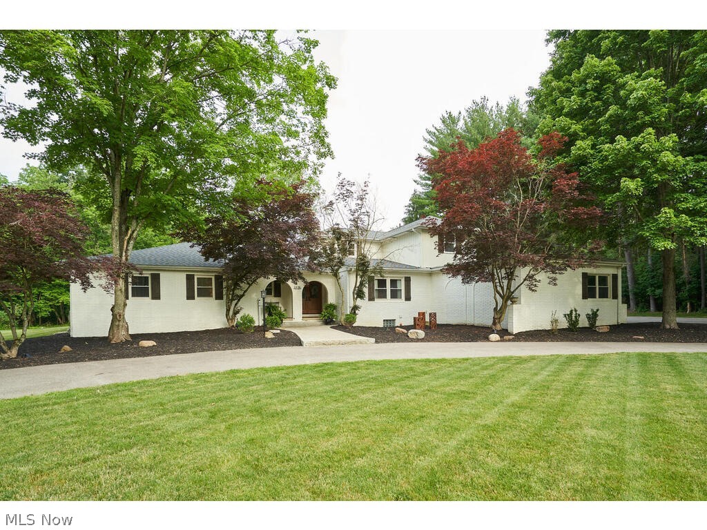 Wonderful completely remodeled home nestled on private street in Bath. Over 3400 sq feet on approx 1.5 acres .Newer double front doors welcomes into this outstanding home. There are bamboo floors in the Living room , dining areas, hall and kitchen, The Living room has natural light with a large picture window over looking the newer patio, and landscaped back yard. The kitchen has been remodeled with cream cabinets, oversized island, a farmhouse sink, backsplash , stainless steel appliances, double ovens ,and warming drawer plus quartz counter tops. This home has formal dining and dinette. The dinette is spacious and can hold an banquet size table and is open from the kitchen. The great room has vaulted ceilings and a 14 ft plus wet bar with great space to display and granite countertops. The first floor master suite has newer carpet,paint and french doors that lead to the backyard. The master closet is every women's dream with built ins!. The master bath has been completely remodeled with subway tile double headed shower a, newer double sink vanity and flooring, There is a second bedroom an full bath also located on the first floor,. The stair case leading upstairs is open and inviting. The second floor has 2 additional bedrooms with double closets and the 3rd full bath that has also remodeled, Extra features of this home is a first floor mud room, A cozy deck off the kitchen,rec room/exercise room. This home has a 2 car garage attached and a 3 detached -plus a large yard surrounded by a tree line for privacy. What else could you ask for!!