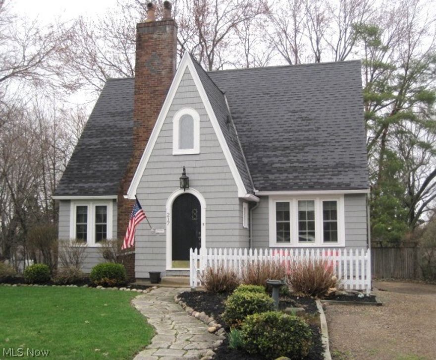 Absolutely charming home boasts great living space and numerous amenities throughout.  Inviting living room with brick fireplace and hardwood floors.  Formal dining room features hardwood floors and breakfast bar overlooking kitchen.  Spacious and bright kitchen offers stainless steel appliances.  First floor bedroom could be den/office.  Generous sized master bedroom with two closets.  Fabulous newer main bath with stained glass window.  Wonderful lower level family room and recreation room with full bath conveniently located.  Extra large lot with great backyard.  New windows.  Exterior newly painted.  Move in ready.