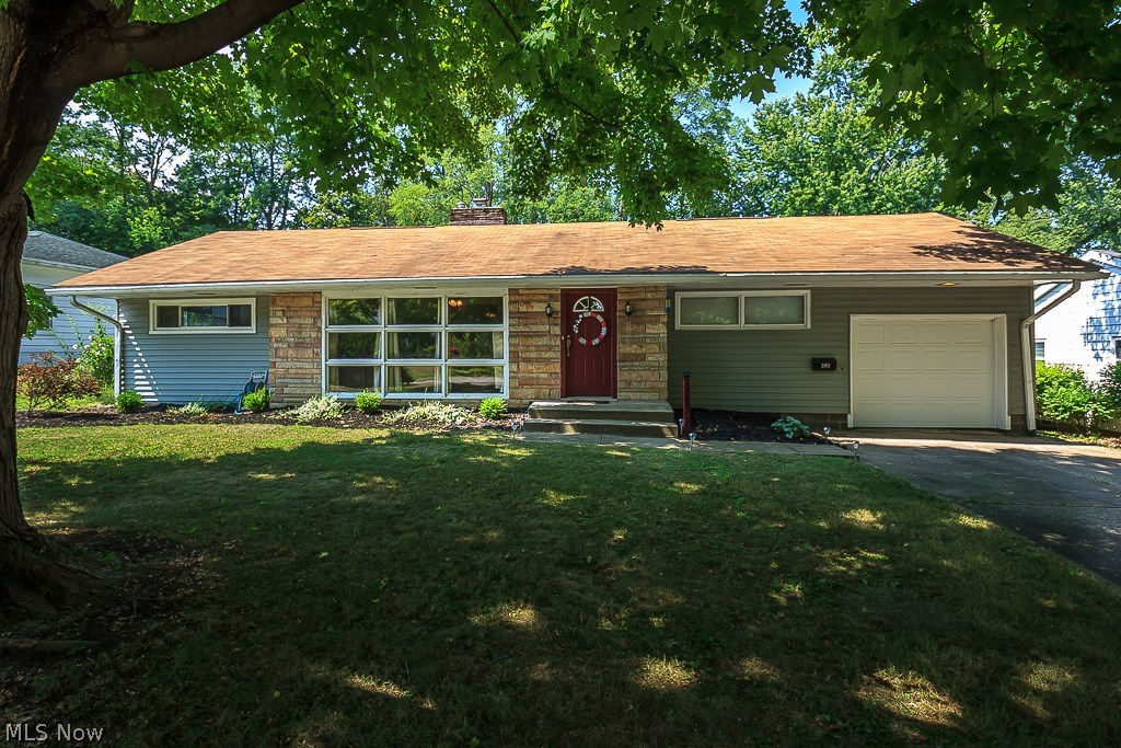 Ready, Set, Move into this adorable, well maintained, 3 bedroom, 1.5 bathroom home nestled right next to the Cuyahoga Valley Metroparks! Immediately upon entering the property you’ll notice this home is immaculate and well cared for. The kitchen has repurposed, neutral gray cabinets, new stainless steel appliances, a large pantry, and plenty of additional storage. The living room has a gorgeous, stone fireplace and floor to ceiling picture windows that let in a large amount of natural light! The master bedroom is updated with trendy white trim and gray carpet and paint, the other two bedrooms are generous in size, and there’s even a laundry shoot in the hall. The yard is HUGE and is completely fenced in. It also has a charming, stone-paver fire pit! With the charm also comes many upgrades such as H2O tank (2016), majority of the windows (2015 with a lifetime warranty), garage door (2016), original hardwood floors were refinished, and all new bedroom carpet (2016). All kitchen appliance