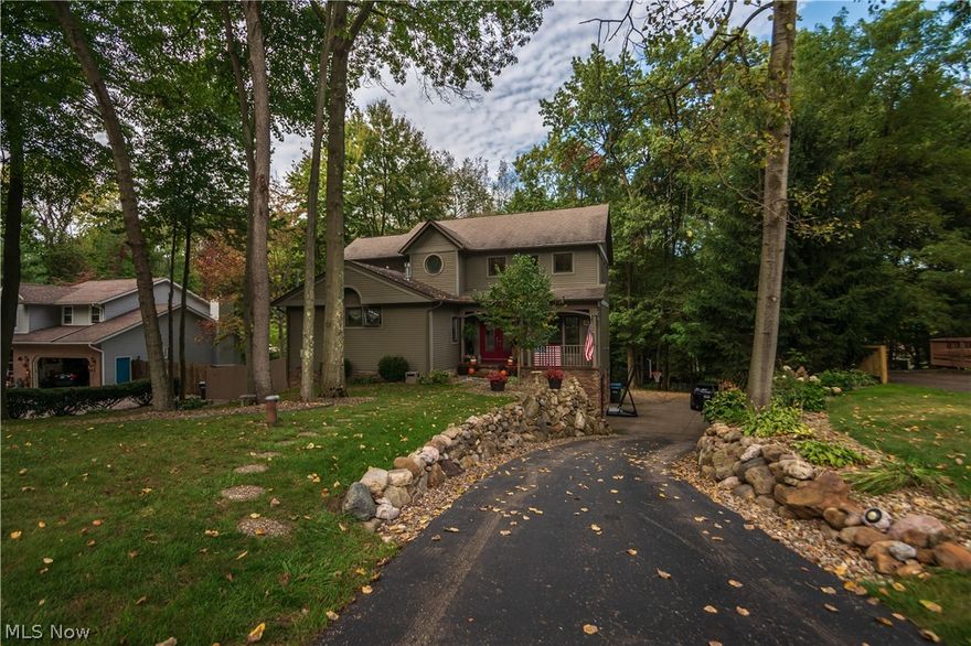 Welcome to this wonderful ,contemporary style home located in Green School District. From the moment you walk in, you will be greeted by the two story vaulted ceilings. Cozy in this fall by the modern stone, gas fireplace in the oversized living area thats open to the kitchen and dining room. A first floor master suite with vaulted ceiling with its own gas fireplace to enjoy while soaking in your jetted tub. Upstairs are two bedrooms that feature a jack and jill style bathroom. Downstairs features an additional living area with a bonus room connected . Enjoy the seasons changing from inside your new home with the massive picture windows looking out to your over half acre wooded lot. Two story deck perfect for entertaining. Come see this home this fall and schedule your private showing today !