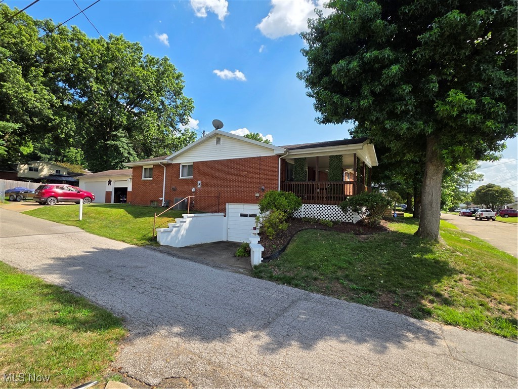 Need extra space for toys? This home has both an attached garage and a detached garage and is located close to parks and shopping. You will find the home boasts a family room as well as a livingroom, central heat and air, and a warm inviting fireplace in the family room. Located on a quiet corner lot and features 1 floor living.