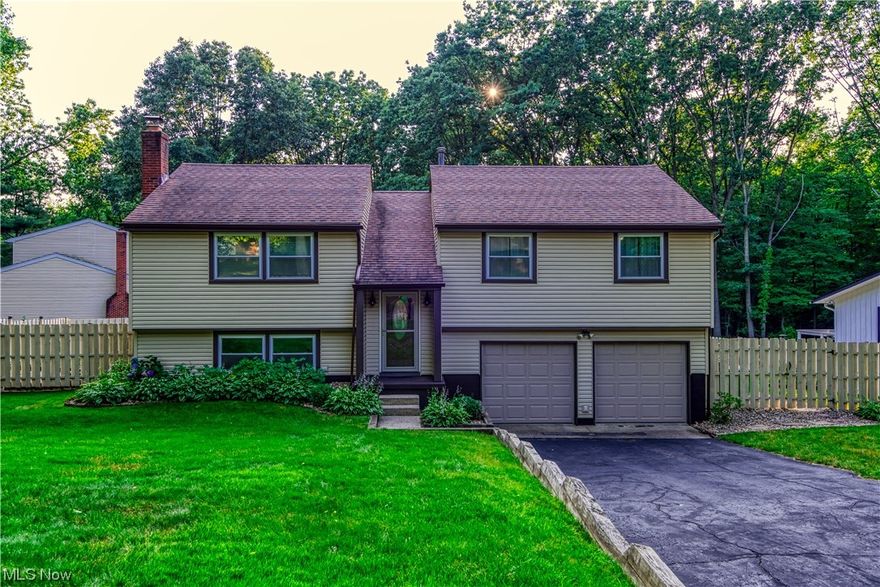 Welcome home to this beautiful bi-level located in a park like setting in Monroe Falls. This 3 bedroom 2.5 bath home is sure to please with its numerous updates, (listed in the broker remarks) large living, dining room that lead to a deck overlooking the fenced in back yard. Which features a fire pit and newer shed! The lower level features a family room with wood burning fireplace and sliders that lead to a patio. Seller is offering a home warranty and appliances will be staying. Great location for parks, shopping and highway access. Check this one out today before its gone!