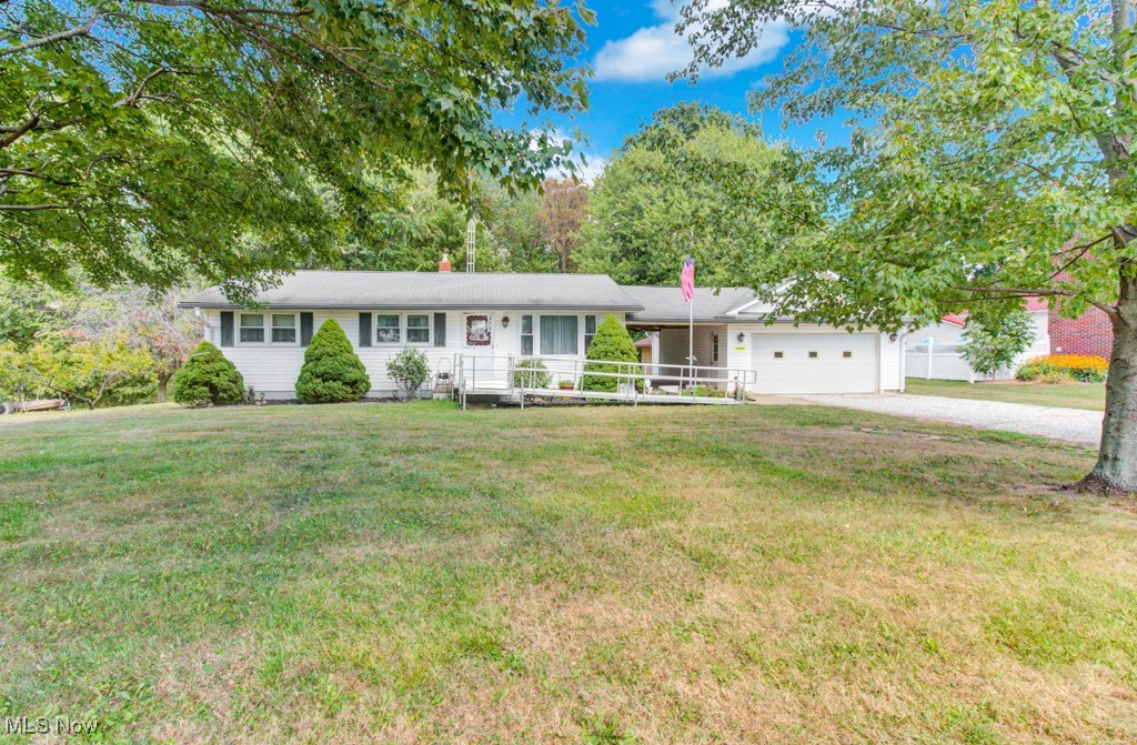 Adorable ranch home in a quiet country setting on approximately one acre offers immediate possession for the next owner. This move in ready home offers 3 bedrooms and 1-1/2 bathrooms. Owner has taken pride in maintaining and updating the home with newer windows, furnace, and countertops. Full walk-out basement. There are hardwood floors under the carpeting if the new owner wishes to change flooring. ALL appliances stay including washer, dryer, and freezer. You'll love spending time on the cozy open breezeway between the house and garage. 12x22 shed in the back yard. Ramp at front door can convey or be removed. Security system in the home. Verizon internet.