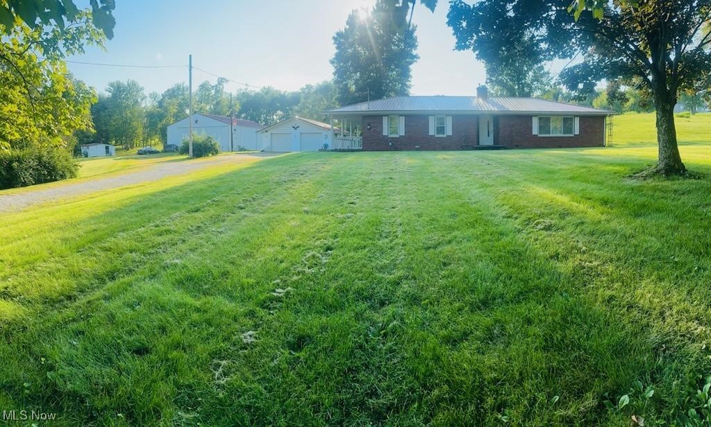 Discover peace, privacy and potential with this beautifully maintained 3 bedroom brick ranch situated on 9.6 picturesque acres just outside of Barlow Ohio. Whether you're looking for a forever home, a hobby farm, or a country retreat, this property has it all. 3 bedrooms 1 1/2 bath full basement, with 9.6 acres of usable land. Pole building perfect for equipment workshop or livestock. Inside the home offers a cozy functional layout. Spacious living room and eat in kitchen, and generously sized bedrooms. The brick construction offers timeless charm and low maintenance, while the surrounding land provides endless possibilities for gardening, recreation, for small scale farming. The 50X30 pole building adds incredible value, ideal for storing equipment, vehicles, or converting into your dream workshop or barn.30X26 detached garage with concrete pad. Located just minutes from the heart of Barlow, and Warren local school district. This royal gem offers the perfect blend of privacy and convenience, with easy access to Marietta and Parkersburg. Don't miss your chance to own this slice of Ohio countryside. Perfect for nature lovers, homesteaders, or anyone seeking space in the Warren school district area. Contact us today for your private showing.