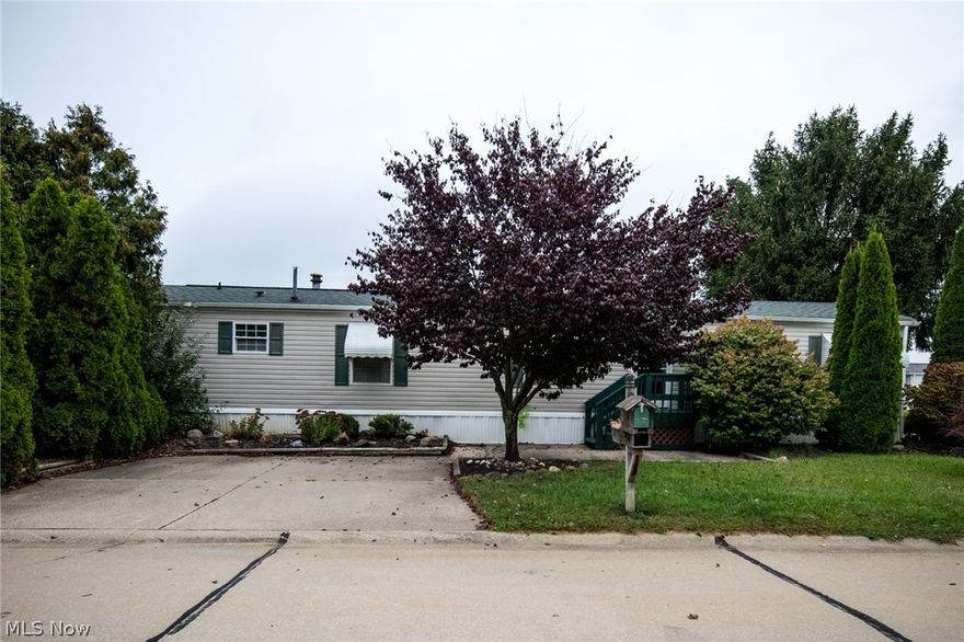 Welcome to this 2 bedroom, 2 full bathroom manufactured home in the Golfway Pines Community. This home features a comfortably sized living room and eat-in kitchen with a separate laundry room. The master bedroom is generously sized and has an attached master bathroom with bathtub and double vanities. You'll find an additional bedroom and full bathroom off the hallway that boasts ample storage. The deck outside is large enough for you to enjoy with family and friends. All appliances remain with the home. Guest parking is conveniently located immediately to the left of this home. You will also have access to the Golfway Pines Community Room for your next family party. Come and see what this home has to offer!