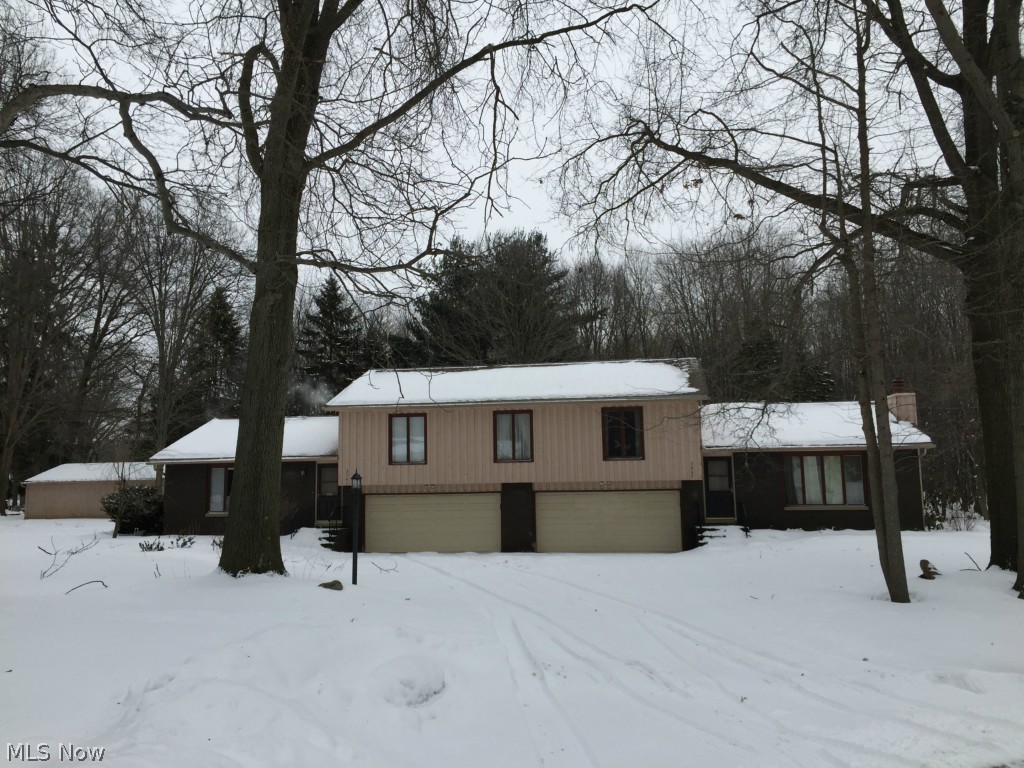 Spacious and well maintained multifamily home available in Stow!! Beautifully updated 3 bedroom, two full bath unit. Perfect for owner occupant, this unit boasts granite counters and stainless steel appliances with large living and dining rooms and details like crown molding and vaulted ceilings. Huge 20X40 outbuilding with electric service, perfect for a workshop! Second unit, ideal for a rental, features 2 bedrooms, 1 bath, a wood burning fireplace as well as plenty of storage in the unfinished basement. Each unit has a two car garage. Separately metered utilities.