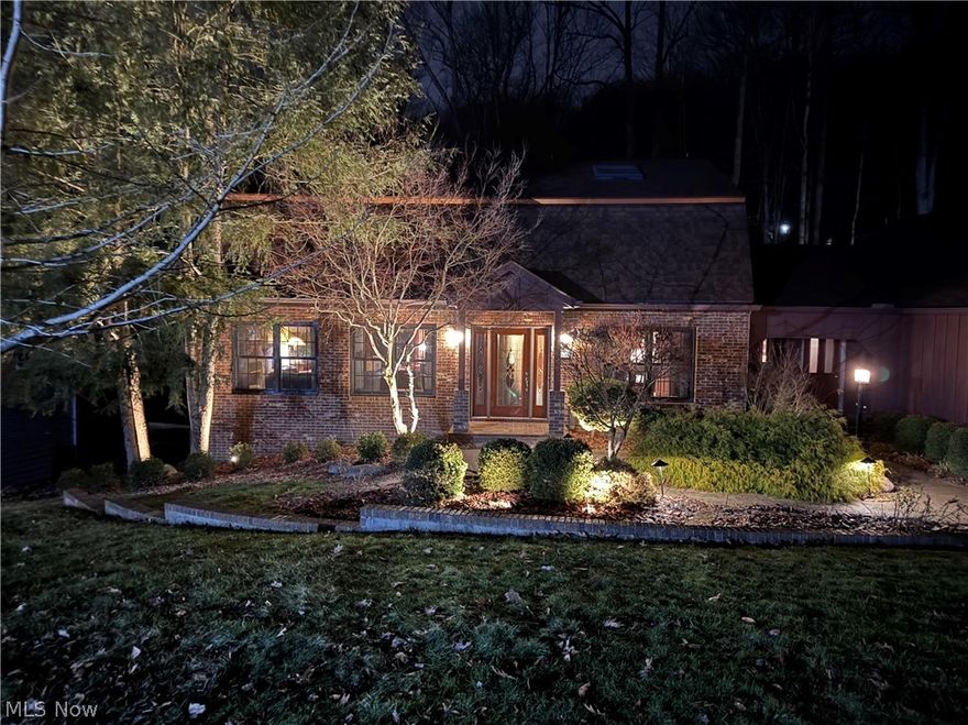 At the end of a quiet, wooded cul-de-sac, 905 Center Court rests in a setting defined by light, privacy, and stillness. Surrounded by a sweeping hillside of mature hardwoods, the home draws the outside in— morning light through expansive windows, evenings softened by birdsong and the hush of the trees.
Inside, more than 3,300 square feet of finished living space unfolds with ease and flexibility. The beautiful upgraded kitchen highlights an LG range, refined contrasting cabinetry and granite countertop with a stunning, panoramic picture window facing the wooded hillside.   
Sunlit living areas flow naturally toward an expansive Trek deck overlooking the forested backdrop—with a hexagonal platform seemingly suspended above the wooded cathedral. 
Your inviting lower-level recreation room features a pool table and sauna in a relaxed retreat primed for game day entertaining.  
Beyond its setting and design, the home reflects careful stewardship: a new roof, updated HVAC and hot water systems, Pella windows, radon mitigation, water softener with reverse osmosis, and a whole-house Generac generator—investments that speak to long-term confidence and peace of mind.
Repositioned with intention for today’s market this property offers a setting that is private, composed, an increasingly rare.