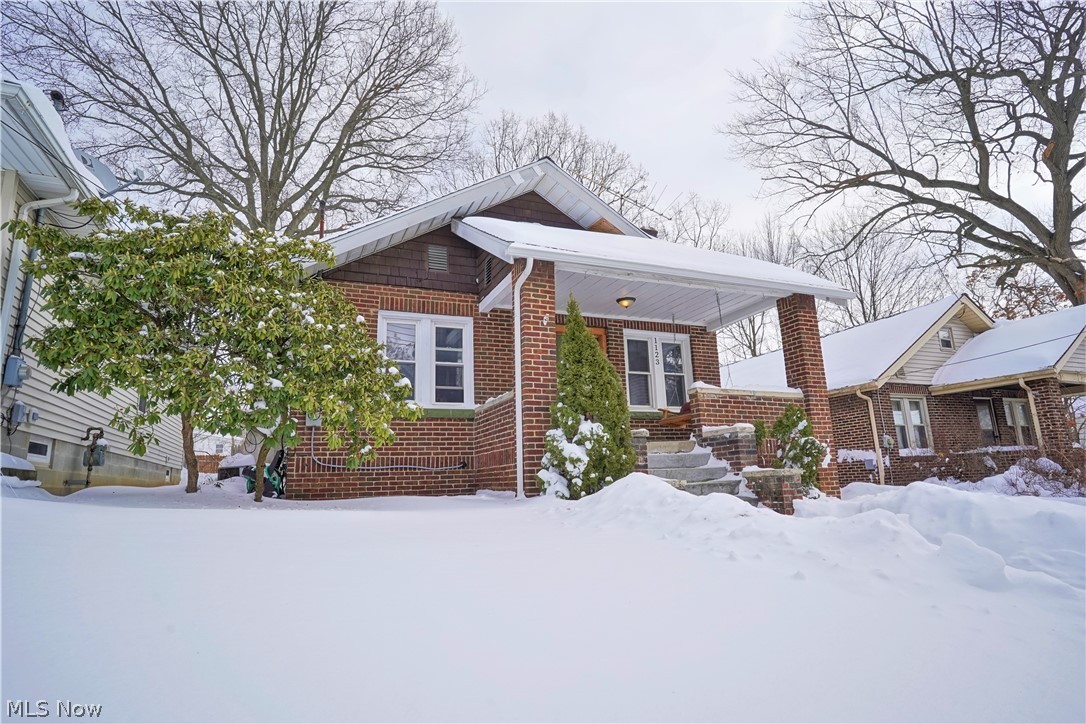 Brick Bungalow with Newly Remodeled Kitchen Stainless Steel appliances....Updated bathroom....Partially finished second floor could be 3rd Bedroom....