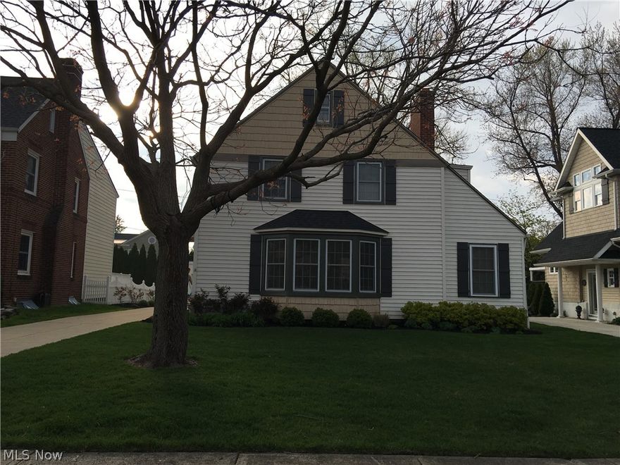 You will be captivated by this classic Beachcliff I/Tangletown colonial featuring a clear nod to the tastes of today's discerning buyer. The home is light and bright with a spacious and practical floor plan. Lovely period details include gleaming hardwood floors, extensive mouldings and built-ins. Important updates, like the modern kitchen and baths include today's "must haves" like granite, high-end stainless steal appliances, tile accents and abundant counters and cabinets.The first floor space provides an unexpected private retreat and the nicely finished lower level offers fantastic casual living space. The exterior is maintenance free and boasts newer windows. Luxury living continues outside with a custom patio and deck overlooking a large yard with plenty of room to play, garden, or relax-and all just a short walk to Oakwood Beach. An oversized 2 1/2 car garage offers ample space to store your "toys"-no matter your age. If you are ready for the Rocky River Lifestyle, this fantast