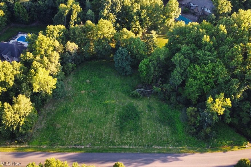 Here is your rare opportunity to build your dream home on over 2 acres in the Hunt Club Development! This lot is mainly flat with wide frontage and also has the privacy you're looking for with trees lining the perimeter and a rolling stream to the right and rear of the lot! This well-kept, pristine neighborhood does not come available often! Don't miss your chance!