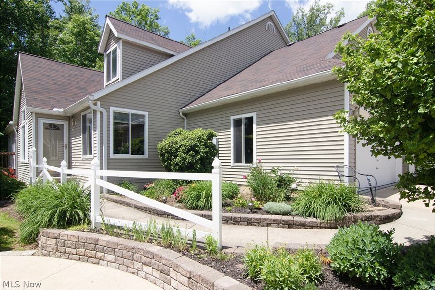 Awesome first floor master condo - backed up the woods not the typical floor plan- So much better!! Cherry kitchen with wood floors are corain counter tops- Double ovens too! Kitchen has corner windows over looking flower beds.Extra large dining room - freshly painted with chair and crown molding.  Great room with vaulted ceilings, gas fireplace, gorgeous maple wide planked floors. First floor master with volume ceilings and new subway tiled shower, cherry cabinets and double sinks, plus large walk in closet.Off the great room is the door that leads to the fabulous screened porch with vaulted ceilings. Its here you will enjoy your morning coffee and watch with wild life in the woods- so peaceful. The upstairs is a large open loft with 2 skylights, 2 bedrooms with double closets and another full bath.. The lower level is a walk out with a finished family room. There are newer laminate floors and a cherry built in with a wet bar- Plus another full bath and a large storage room that is dr