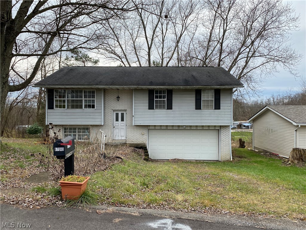 This cozy split level home offers 3 bedrooms, 1 full bath and 2 half baths, and a 2 car garage in the basement. Located in a neighborhood with nice homes.