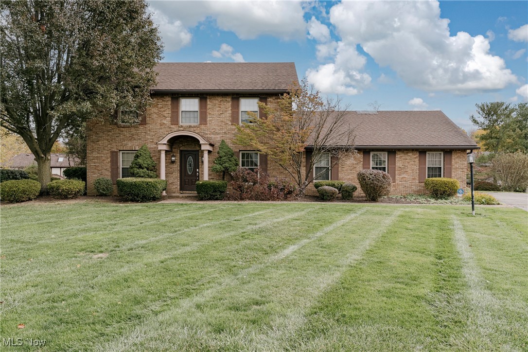 Welcome to 7942 Loriwood Cir NW; a stately all-brick colonial in a peaceful Cul-de-Sac setting. This classic home offers timeless charm, quality construction, and a gracious floor plan designed for comfortable living and entertaining. This colonial home is located in Jackson Township offering access to Jackson Township school system, featuring a yard, coi fish pond and an attached two car garage your new home awaits! Step inside through the inviting foyer and discover a spacious living room featuring a beautiful brick fireplace framed by built-in shelving, perfect for cozy evenings at home. There is also an impressive sunroom, where exposed brick walls, a vaulted ceiling with skylights welcoming 180 degrees of natural light, and three walls of windows fill the space. It’s the ideal spot to relax, entertain, or enjoy morning coffee with a view of the serene backyard and patio. Across the foyer, the formal dining room showcases gleaming wood paneling and wainscoting, adding warmth and character. The kitchen offers abundant cabinetry, a center island, all appliances included, and a sunny eat-in area with a bay window overlooking pristine lawn. A convenient laundry room and a half bath complete the first floor. Upstairs, you’ll find three comfortable bedrooms, including a spacious primary suite featuring an ensuite bath with a jetted tub, step-in shower, and two closets; one a walk-in. A second full bath serves the remaining two bedrooms. The full basement provides plenty of storage and offers excellent potential for finishing into additional living space. Outside, the backyard is a true retreat with a charming patio, built-in fire pit, and side yard that is surrounded by tall trees adding privacy and shade. This home with an attached two car garage, located in a quiet neighborhood near shopping and a hospital, combines space, character, and comfort; ready to welcome its next owners.