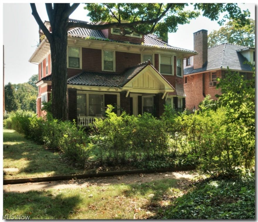 Statuesque framed center hall colonial overlooking The British Garden, the very first garden designated in the Historic area of Cleveland’s Cultural Gardens.  This stately and commanding home exudes charm and architecture of yesteryear.  This block of homes is buffered from the street by the gardens so the street is further away making the area serene and parklike. You are greeted by the homes lovely English gardens and huge front porch.  Large Living and Dining rooms with many replacement windows, natural woodwook, hardwood flooring, tall ceilings, ready for entertaining and family living.  Kitchen has lots of cabinetry and countertops and has been opened to the Dining room.  Back hall entry with ample space for coats and storage.  A half lav and den/office are tucked away on the 1st floor too.  Two staircases to the 2nd floor which has four bedrooms and a full bath.  The 3rd floor has a large family room with bookcases, bedroom and the makings for another bathroom.  Lower level is op