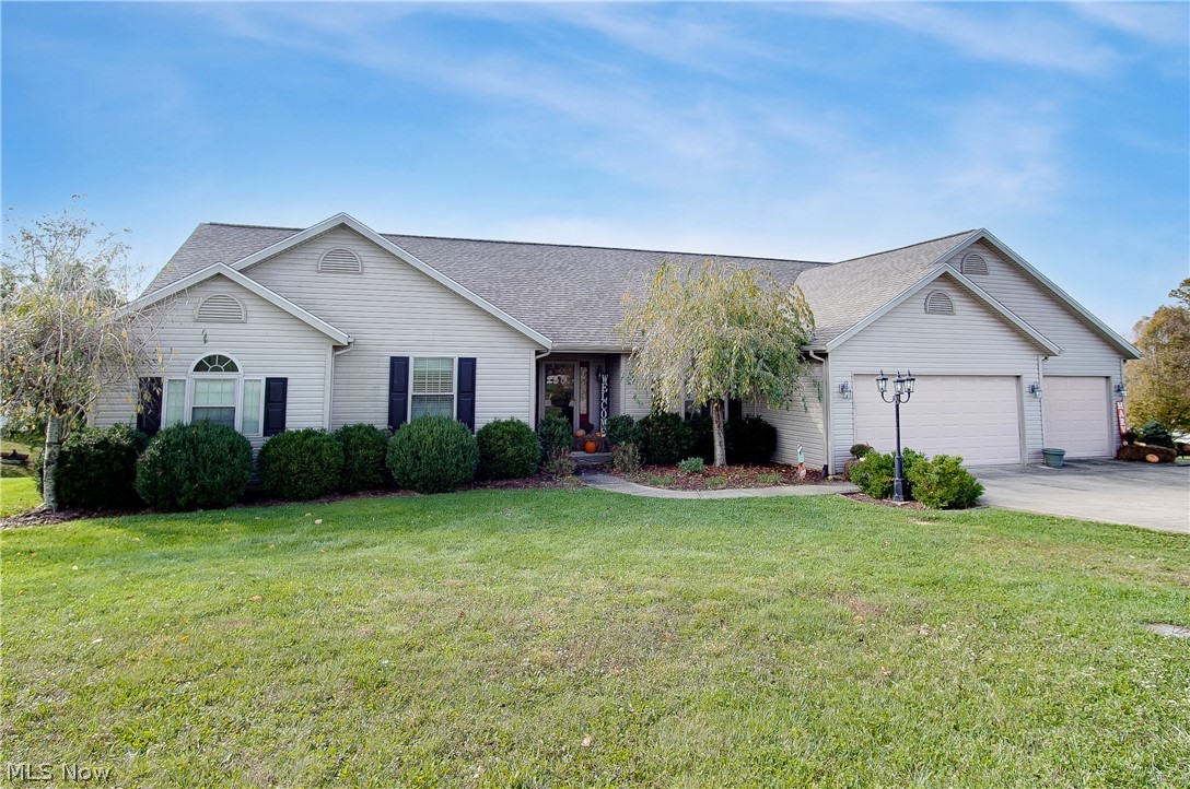 This is a beautiful, one owner home, that has been very well maintained and is located on 2 parcels that total 1.15 acres! With the extra large lot, there is plenty of room to spread out and enjoy! When you enter, you will love the large, open concept of the main living area and kitchen, that also leads to the 1st floor laundry and the 5 car attached garage! The bedrooms are very nicely sized and the owner's suite has a master bath with a tub/shower combo and a walk-in closet attached! It has a poured wall foundation and there are 2 walkout exits in the lower level, along with a large egress window as well. This area could easily be finished to your liking and provide a ton of additional living space, especially with the abundance of natural light coming in too! There is public water & sewer and all utilities are underground! Located on a dead-end cul-de-sac that is sure to please! Call today!