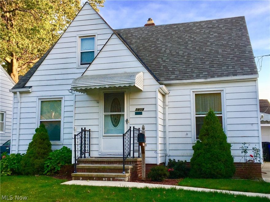 Look No Further, enjoy a great location at 5809 Traymore Avenue Cleveland! Has 3 bedrooms and 2 full baths. Beautiful private back yard, one car garage and newer driveway (2014). Spacious eat-in Kitchen with brand new back splash. Newer roof complete tear-off, windows, HWT, and central air unit. Original hardwood flooring, cove ceilings and tons of charm. Second floor space with bedroom and full bath. Basement partially finished. All Appliances Stay and One year Home Warranty! Must See!!!
