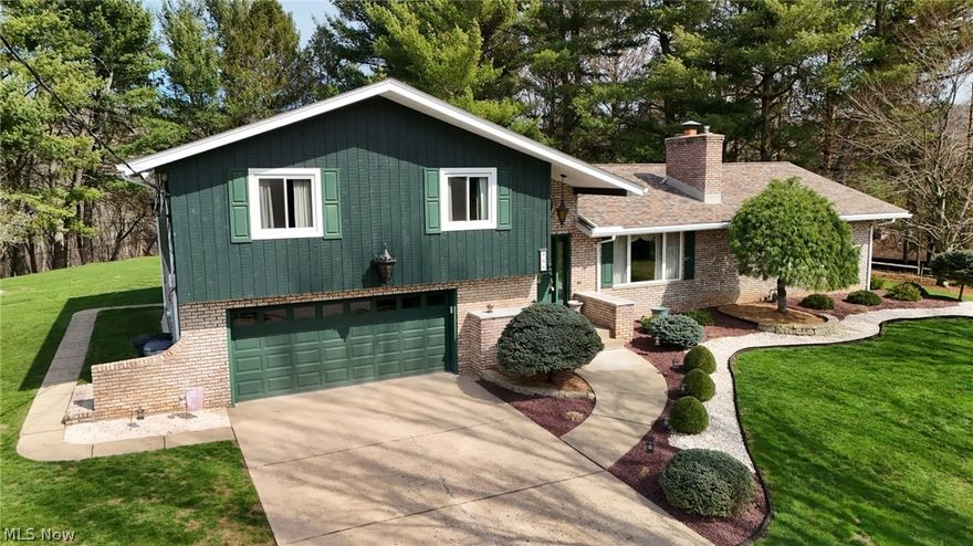 Be the next proud owner of this meticulously maintained 4BR, 3BA brick beauty situated on a .76 acre lot tucked in a tranquil cul-de-sac within a desirable subdivision in Weirton, WV. You will be welcomed by tons of natural light as you enter into an open floor plan with sunken living room featuring a beautiful dual sided gas log fireplace complimenting the first floor family room with handsome wet bar. Just off the family room is a sliding glass door leading to a covered patio perfect for seamless indoor-outdoor entertaining. The expansive yard offers privacy, a storage shed and perfection in landscaping with mature trees and stone accents that boasts pride in ownership and instant curb appeal. The large, well equipped kitchen provides abundant cabinetry and counter space, making hosting in the tasteful dining space effortless. With almost 3000 sq ft of total living space all 4 bedrooms are generously sized with ample closets and neutral décor. The master suite showcases an updated private bath with large walk in tile shower. A convenient laundry room and full bath sit just off the 2 car garage steps away from the main level of the home. The huge finished basement rec room offers separation and quietness with a gas log fireplace, plus a separate storage/utility room and crawl space providing so much flexibility and easy organization. Recent updates include the roof, windows and 200 amp electric service. This home is a retreat style of living offering the perfect blend of everything you've hoping to find in your forever home. Home Warranty​​‌​​​​‌​‌​​​‌‌​​​‌‌‌​​‌​​‌‌​​​​ Included.