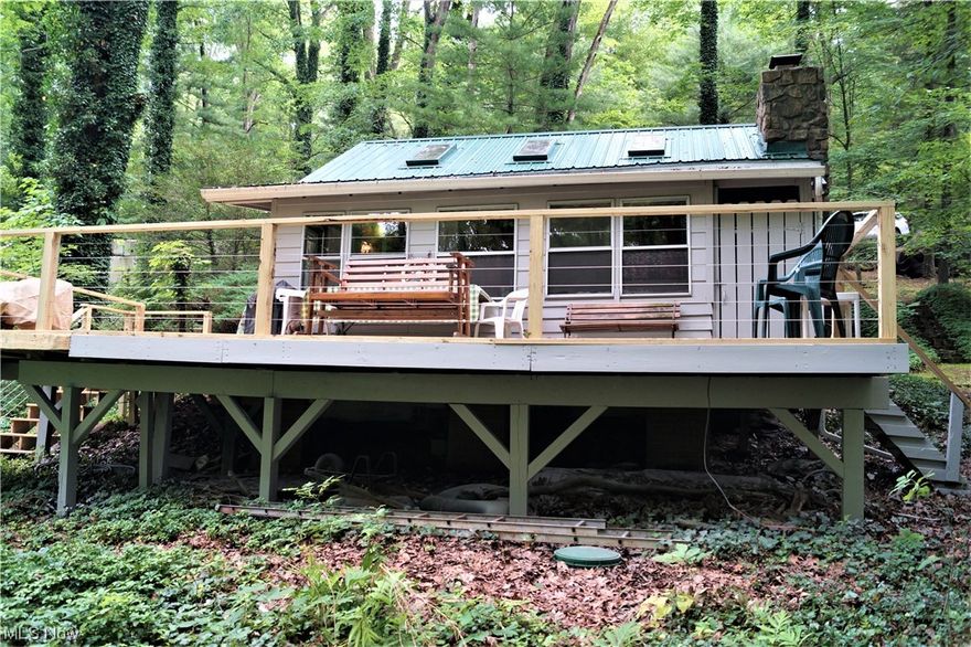 Lake front cabin at Leesville Lake located in lovely Rockwood Park! Escape the busy day to day life and come to the lake for the fun and play life! Mostly furnished with 2 bedrooms, loft, gally kitchen, new flooring, freshly painted inside and out, newer metal roof and new deck 2023. Leesville Lake has 1000 acres of the best muskie fishing around! Immediate possession! Dock included and is within walking distance of the cabin! (RPOA is currently working on updating their bylaws to enforce no rentals or air bnb's.)