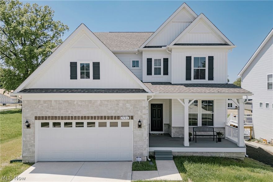 Welcome to 7796 Clydesdale Dr, a recently completed contemporary colonial with custom upgrades and refined finishes throughout. Lightly lived in, this home offers the appeal of new construction with thoughtful enhancements. A welcoming front porch opens into a bright foyer. The foyer flows into a formal dining room featuring wainscoting, a tray ceiling, and LVP flooring that continues through the main living areas. At the back of the home, the layout opens into a spacious living room and kitchen designed for everyday living and entertaining.The kitchen features a large center island with breakfast bar seating, quartz countertops, a tile backsplash, and stainless steel appliances. A walk-in pantry connects the kitchen to the dining room. Just off the kitchen, a dining area includes sliding door access to the back deck. The living room offers a comfortable gathering space centered around a fireplace. A nearby flex room can serve as a bedroom or office. A half bath and mudroom complete the first floor. Upstairs, a loft provides additional living space. The second floor includes four bedrooms with neutral finishes. The primary suite features a tray ceiling, two walk-in closets, and an ensuite bath. A bonus room off the suite adds flexibility. A second full bath and laundry room complete the level. The full walk-out basement offers excellent potential for finishing and includes plumbing for a future bath. Schedule your tour today!