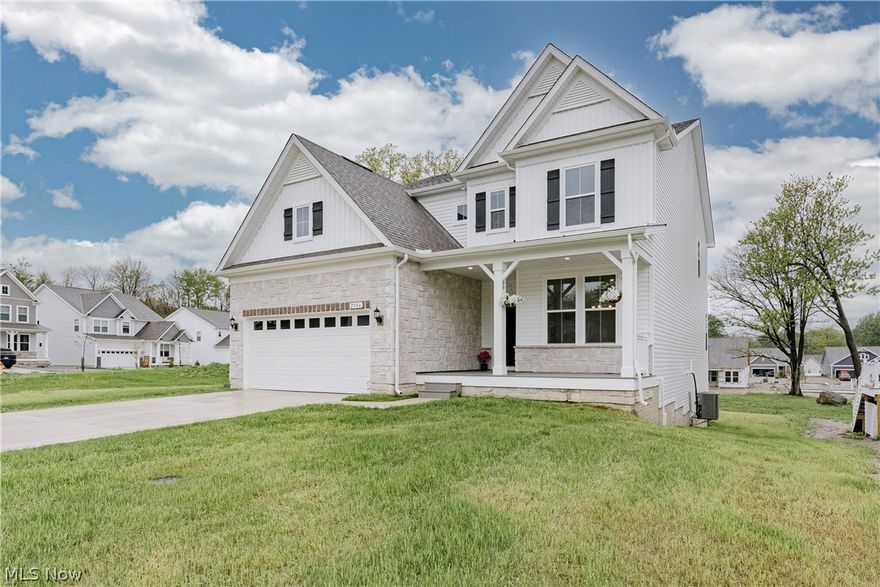 Welcome to 7796 Clydesdale Dr, a recently completed contemporary colonial with custom upgrades and refined finishes throughout. Lightly lived in, this home offers the appeal of new construction with thoughtful enhancements. A welcoming front porch opens into a bright foyer. The foyer flows into a formal dining room featuring wainscoting, a tray ceiling, and LVP flooring that continues through the main living areas. At the back of the home, the layout opens into a spacious living room and kitchen designed for everyday living and entertaining.The kitchen features a large center island with breakfast bar seating, quartz countertops, a tile backsplash, and stainless steel appliances. A walk-in pantry connects the kitchen to the dining room. Just off the kitchen, a dining area includes sliding door access to the back deck. The living room offers a comfortable gathering space centered around a fireplace. A nearby flex room can serve as a bedroom or office. A half bath and mudroom complete the first floor. Upstairs, a loft provides additional living space. The second floor includes four bedrooms with neutral finishes. The primary suite features a tray ceiling, two walk-in closets, and an ensuite bath. A bonus room off the suite adds flexibility. A second full bath and laundry room complete the level. The full walk-out basement offers excellent potential for finishing and includes plumbing for a future bath. Schedule your tour today!