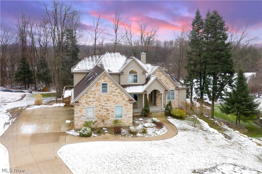 Stunning 4-5 bedroom home, 4.5 Bathrooms, 4,586sf of finished area including walk-out lower level finished basement w/ bar & theater area, magnificent water views of the private waterway, home is located at 2051 East Swan Lake Circle in the Beautiful Twin Lakes area of Kent Ohio in highly sought after Lake Royale Development cul de sac lot. Bonus room over 3-car garage can be used as bedroom or additional recreation room. This stunning resort like home on the waters edge boasts a two story Great Room & wonderful stone accented gas fireplace wall. Master Bedroom & Master Bathroom are on the 1st floor with views of the water as well! Roomy kitchen w/ tons of cabinets & stainless steel appliances for the chef in you. Full walk-out basement includes an Entertainment area, full wet bar & bonus room can be an office as well as a 5th bedroom or home office. This spacious home also includes foyer, laundry room, garage entry from large 3 car garage, large deck as well as a concrete patio, worko