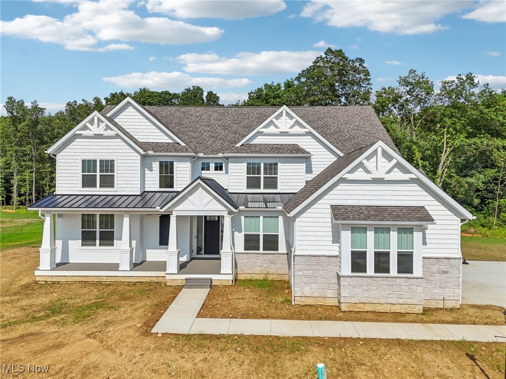Welcome to this stunning, already built - new construction home in Sharon Township, located in the sought-after Highland school district! This bright and airy Northern Craftsman by Pulte impresses from the start with a grand foyer, sweeping ceilings, a first floor suite, and an attached, 4+ car garage (with epoxy flooring to be completed before closing)!
Entertain in the dramatic, two-story living room featuring a fireplace, wall of windows, and views of the upper-level catwalk.
Prepare culinary delights in the custom chef’s kitchen with upgraded KitchenAid appliances, under cabinet lighting, showcasing an expansive center island/breakfast bar, extensive cabinetry, a walk-in pantry, and an eating area with access to the deck. A butler’s pantry provides flexible space to suit your needs.
Retreat to the first-floor ensuite bedroom, complete with a full bathroom and walk-in closet.
Nearby, a well-equipped laundry room with outdoor access, a mudroom with custom built-ins, and a half bath enhance everyday functionality.
Upstairs, the luxurious owners' suite includes tray-ceilings, two generous walk-in closets and an elegant bath with double vanities, a soaking tub, and a huge, glass-enclosed shower.
Three additional, generous sized bedrooms, two full baths (including a Jack-and-Jill), and an office with French door complete the second level. The spacious finished basement adds extra living space with a full bath, perfect for guests or recreation.
Enjoy outdoor living on the covered deck with ceiling fans, and an extended bonus deck by Klassic Decks, overlooking peaceful views of a pond and a wooded backdrop.
This brand-new home has every upgrade for new builds, including an extensive exterior LED lighting package, security and electronics package, black metal accent roof, upgraded paint and elevation, boasts a serene setting on a cul-de-sac, all while being conveniently near shopping, restaurants, and expressways. Pre approved buyers only.