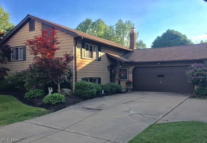 Here's your next home, beautifully maintained bi-level located in the sought after Perry School system.  Situated on a half acre park like setting with a fully fenced yard.  Between the nice open floor plan and large all season room this home is perfect for entertaining!  With over 2100 sq. ft. of living space, the possibilities are endless.  Large open lower level living area has a full wall fireplace great for those cold winter nights.  Newer updates include electrical panel, water heater, pump and garbage disposal.  All Appliances will stay!  Location, Location, Location!!