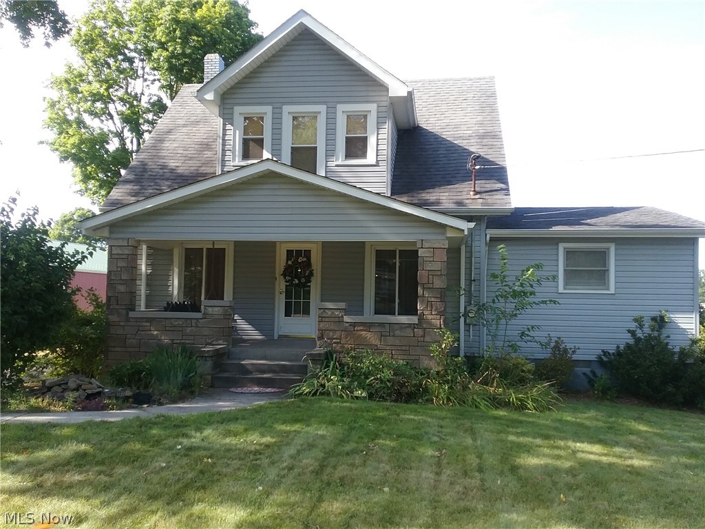 1920 Craftsman home ready for you to move right in. Lots of original woodwork, original woodwork and a lovely front porch to relax on. Story and 1/2 with main floor master, full, remodled bath, Large living room with decorative fireplace, galley kitchen with pantry storage and appliances, dining room and a bonus room that can be TV room, toy room, office or other. Upstairs are 2 bdrms and another full bath with claw foot tub for soaking. Lots of storage in this older home and a beautiful, corner lot yard. Detached, 2 car garage with overhead storage. Per seller, hardwood floor under carpet in living rm. Also, per seller, property is unzoned. Updates in past 10-15 years, windows, carpeting, lighting, laminate flooring.