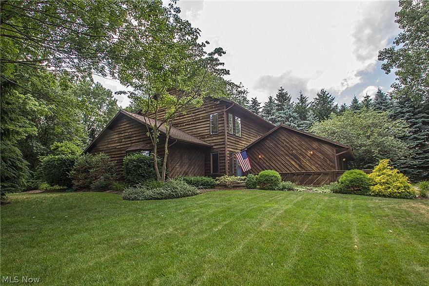 Nestled into a beautiful wooded lot on a quiet cul-de-sac yet conveniently located just outside Kent's city limits, this Franklin Twsp. 1987 CONTEMPORARY GEM has much to offer the discerning buyer. With 1st floor bedroom next to full bath & laundry, it's ideal as a mother-in-law suite! The original owners have loved & cared for the property, updating kitchen with stainless/granite; installing new roof (2011). Throughout, evidence of consistent updating--whether it's the slate & wood entry upgrade or the ceramic flooring added in hall, first floor bath, & kitchen; adaptations to heating/cooling system including heat pump; new well pump (2013); the addition of a 600 sq. ft. deck or the addition of a finished lower level rec room. The alternative heating/cooling systems allow you to be as "green" as you want to be, details of which can be described further by owner. The 2+ garage, with double doors to back yard in the third "bay," is flexible as well as serviceable. Entertaining is a cinc